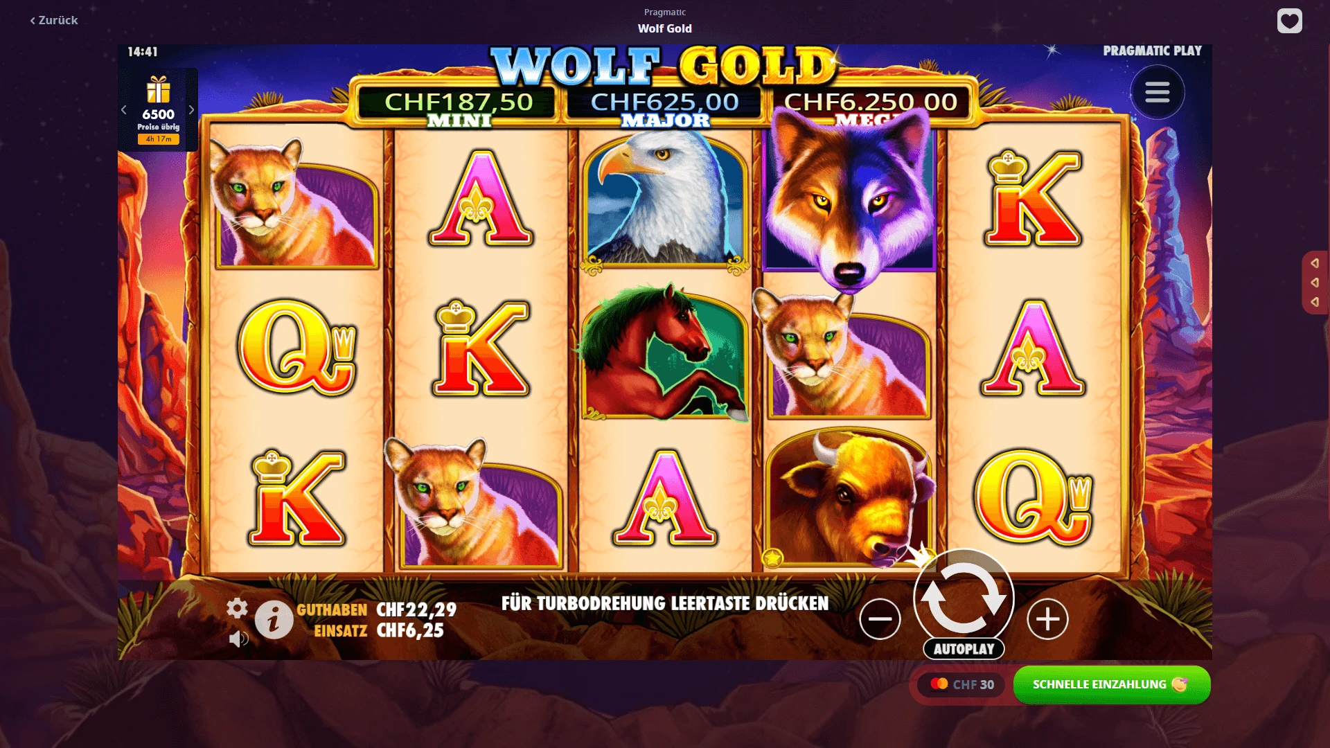 Wolf Gold Screenshot Wolf Gold Slot-Raster mit einer Felsenlandschaft im Hintergrund und Tier-Symbolen.
